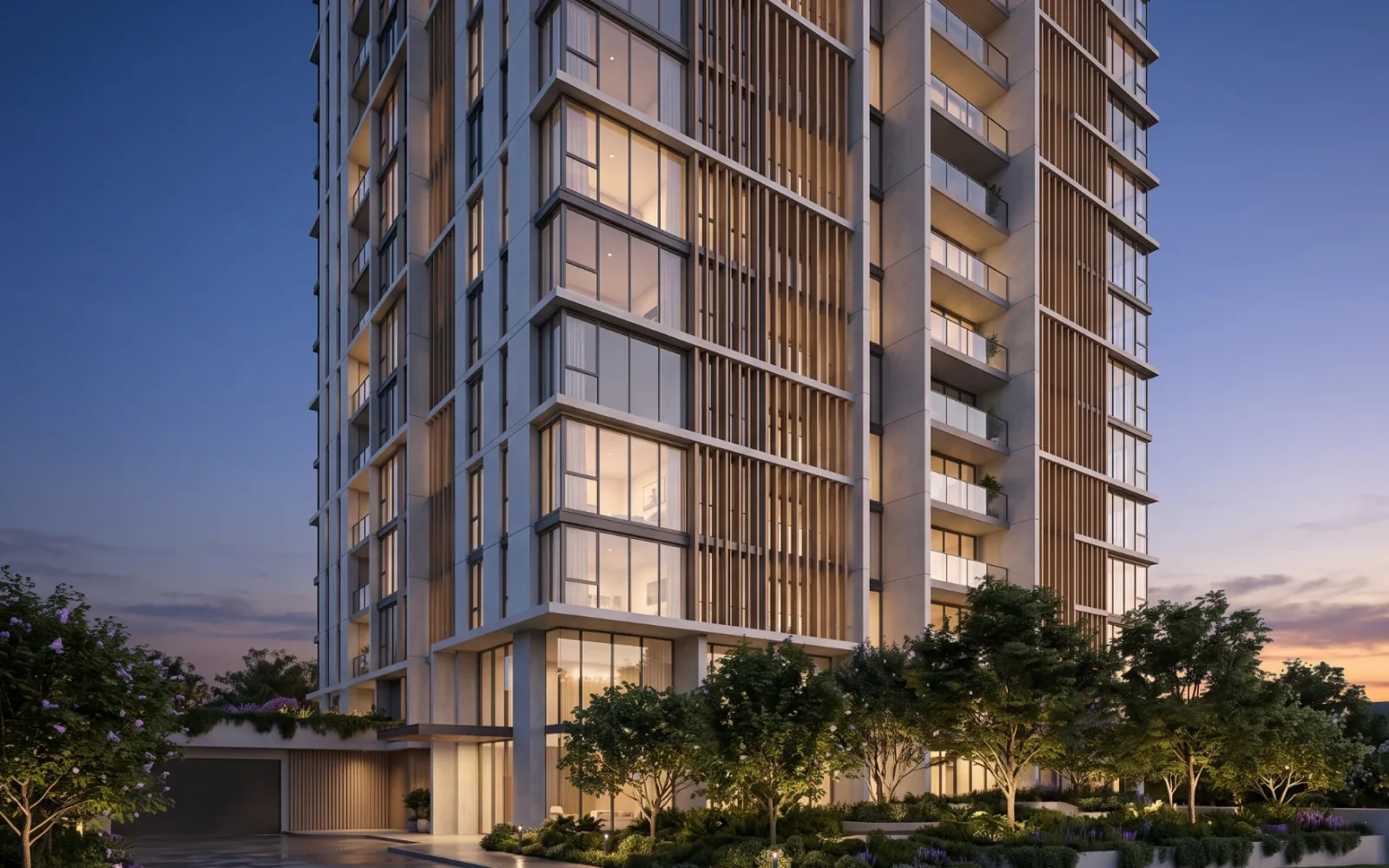 Dusk exterior render of a residential tower with timber fins, lit windows and a landscaped podium
